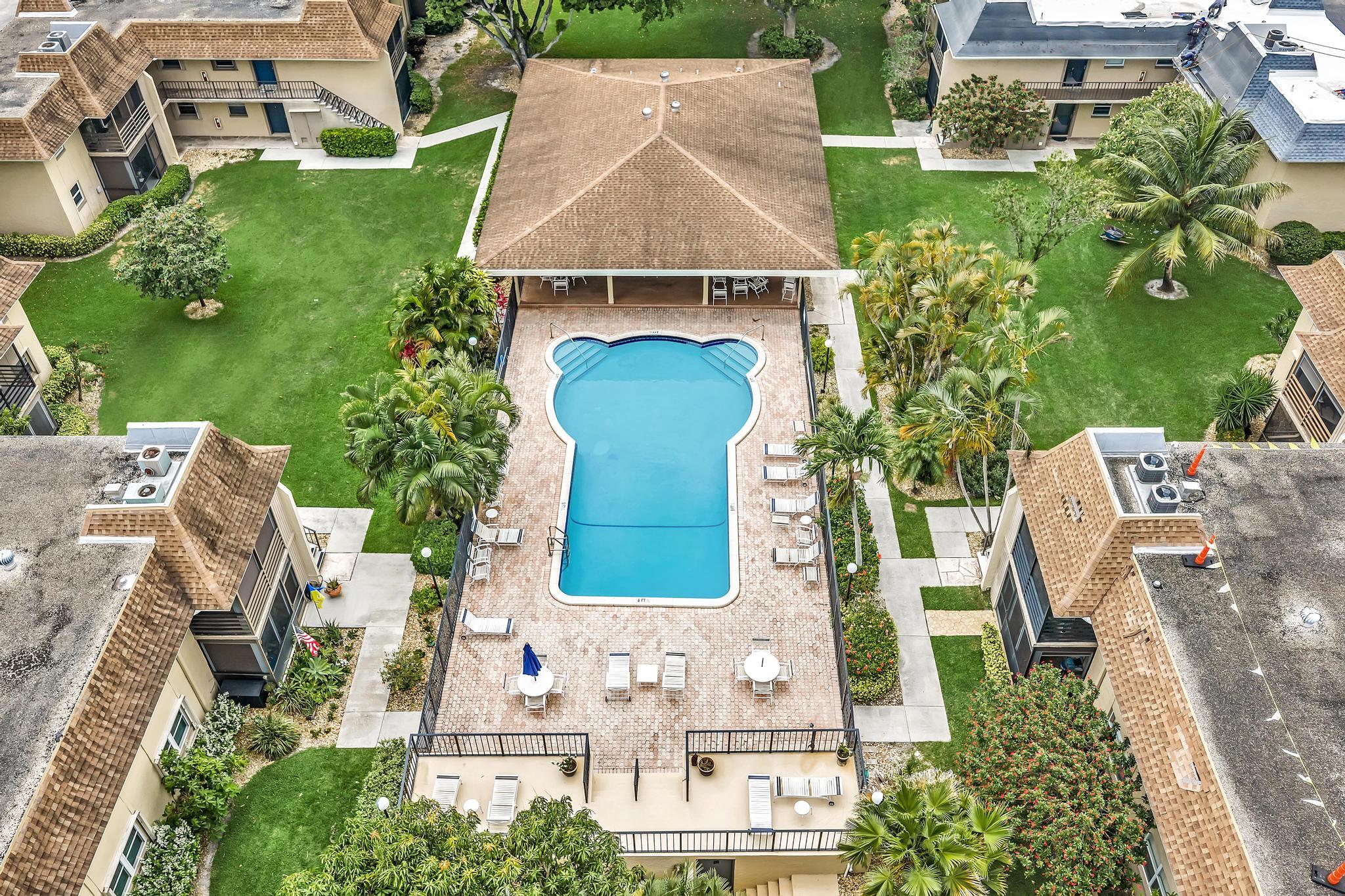 1291 Northwest 13th Street, Unit 445D Boca Raton, FL 33486 - Photo 49 of 50 an aerial view of a house with garden space and street view