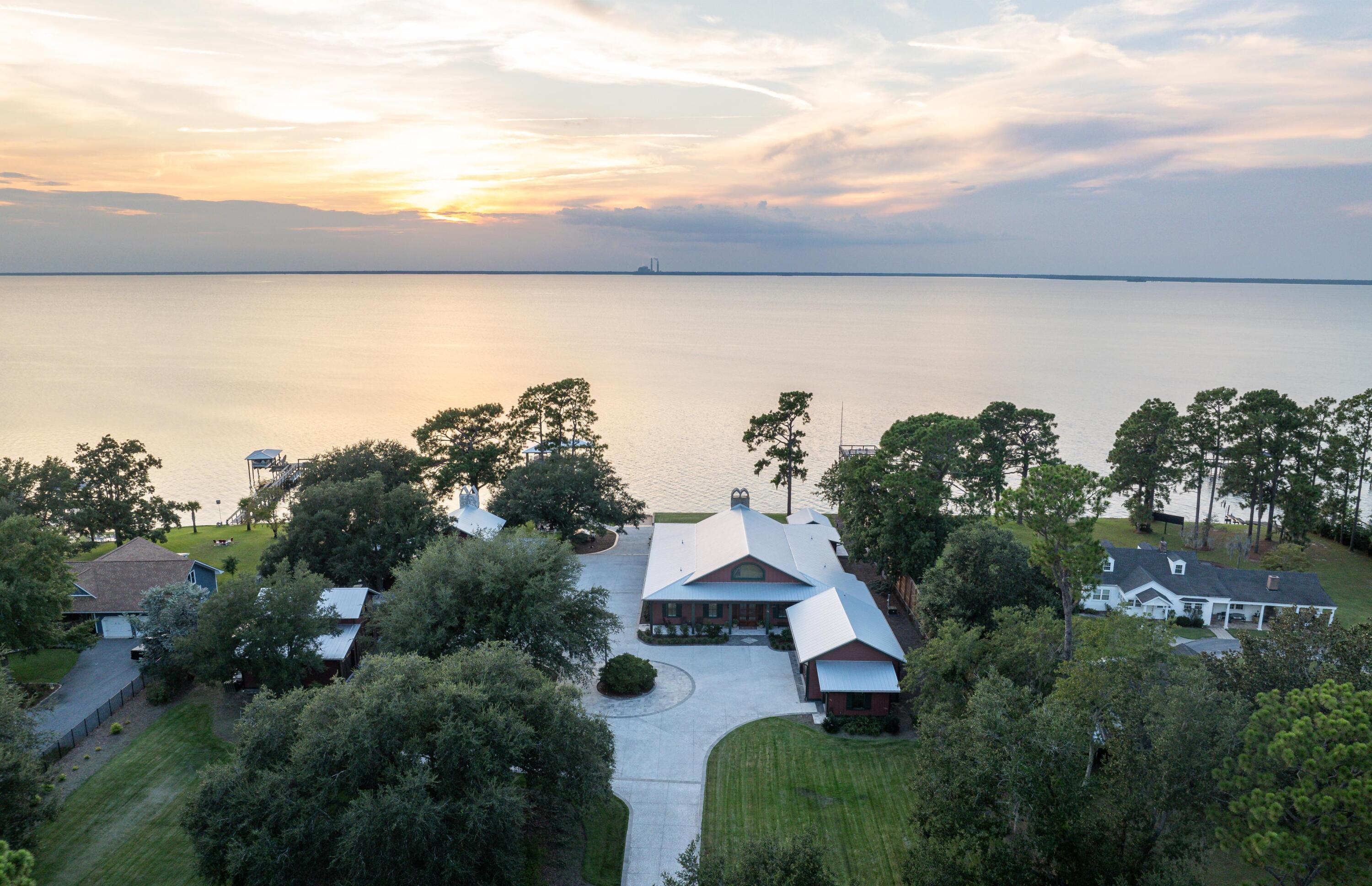 911 Butter Road Bonneau, SC 29431 - Photo 60 of 60 Sunset Drone from Front