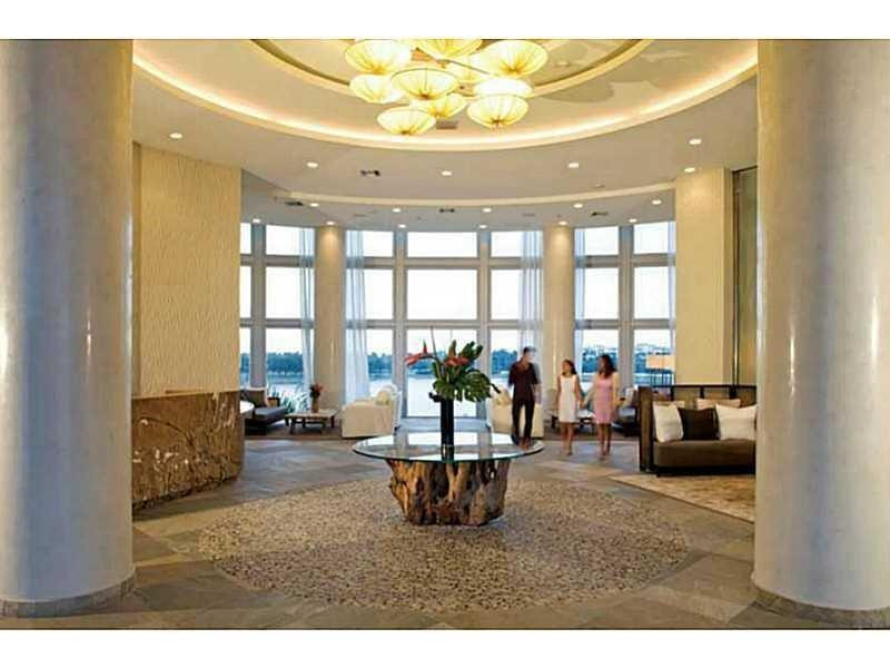 2681 North Flamingo Road, Unit 2604S Plantation, FL 33323 - Photo 5 of 16 a living room with furniture and a large window