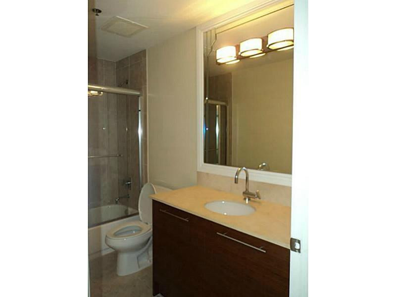 2681 North Flamingo Road, Unit 2604S Plantation, FL 33323 - Photo 10 of 16 a bathroom with a sink toilet and shower