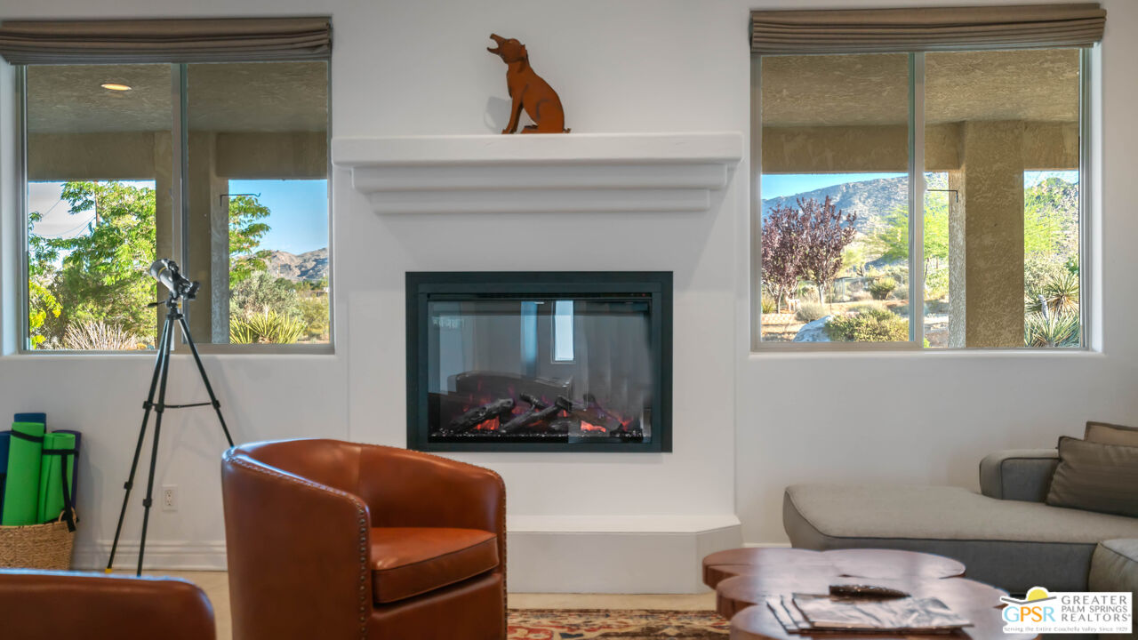 7514 Sunset Road Joshua Tree, CA 92252 - Photo 11 of 69 a living room with furniture and a fireplace