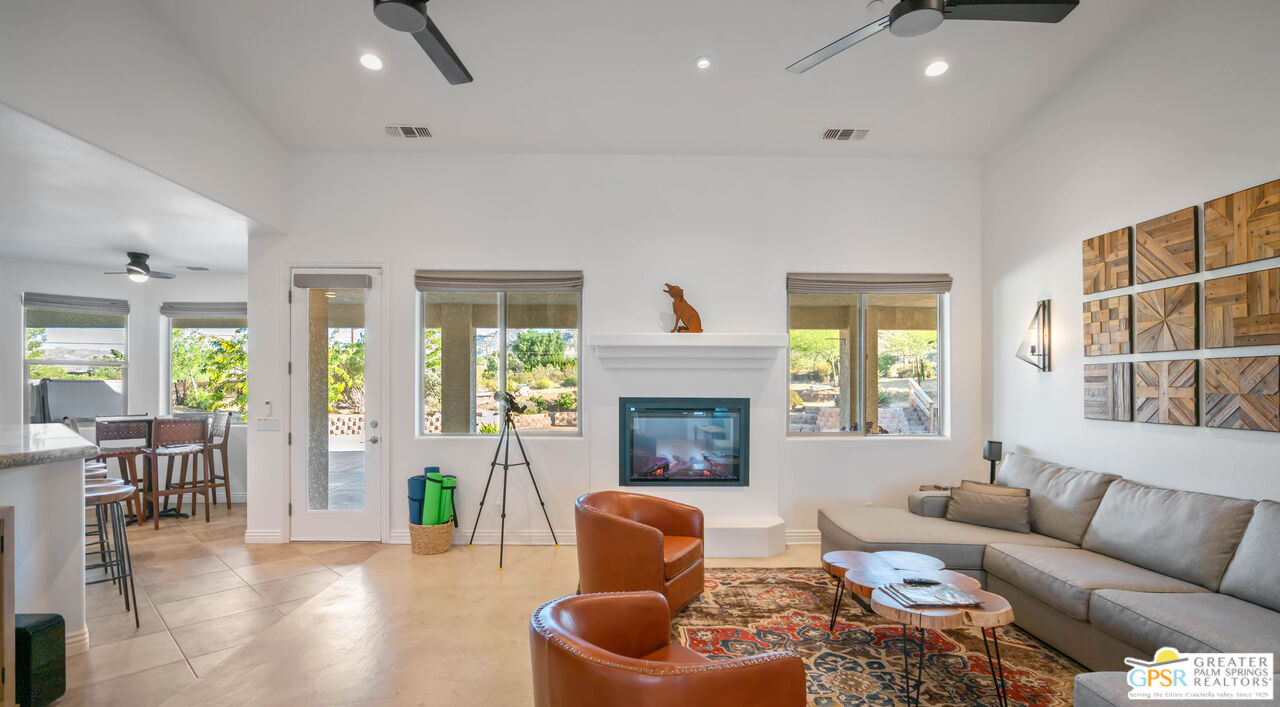 7514 Sunset Road Joshua Tree, CA 92252 - Photo 12 of 69 a living room with furniture and a fireplace