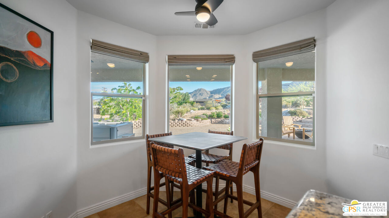 7514 Sunset Road Joshua Tree, CA 92252 - Photo 19 of 69 a view of a dining room with furniture and a window