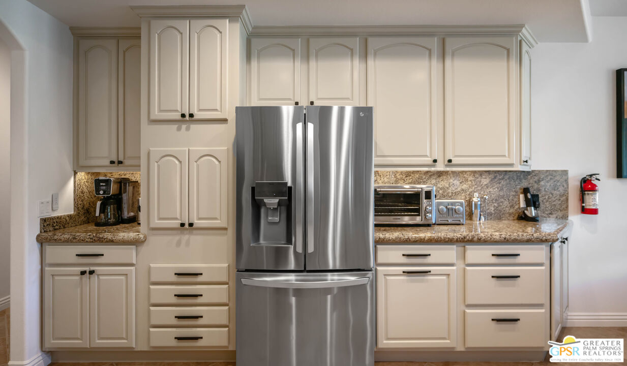 7514 Sunset Road Joshua Tree, CA 92252 - Photo 24 of 69 a kitchen with appliances cabinets and a counter top space