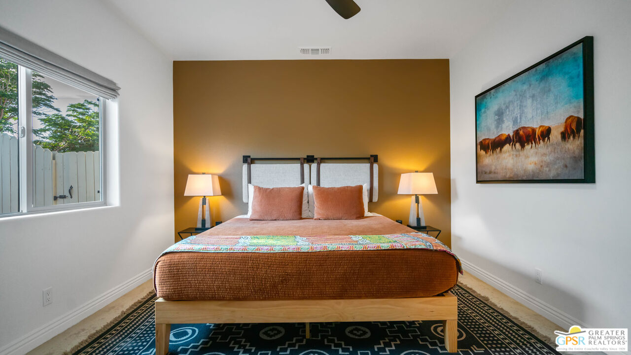 7514 Sunset Road Joshua Tree, CA 92252 - Photo 28 of 69 a bedroom with a bed and window
