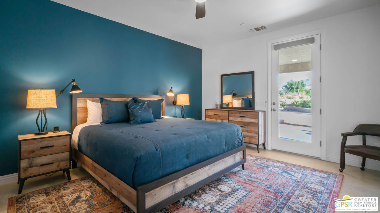 7514 Sunset Road Joshua Tree, CA 92252 - Photo 32 of 69 a bedroom with a bed and a table in it
