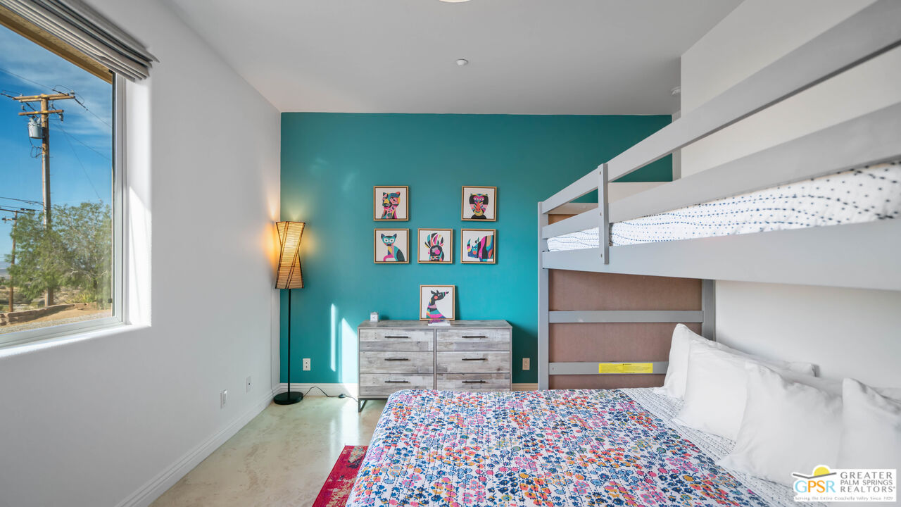 7514 Sunset Road Joshua Tree, CA 92252 - Photo 43 of 69 a bedroom with a bed and a cabinets