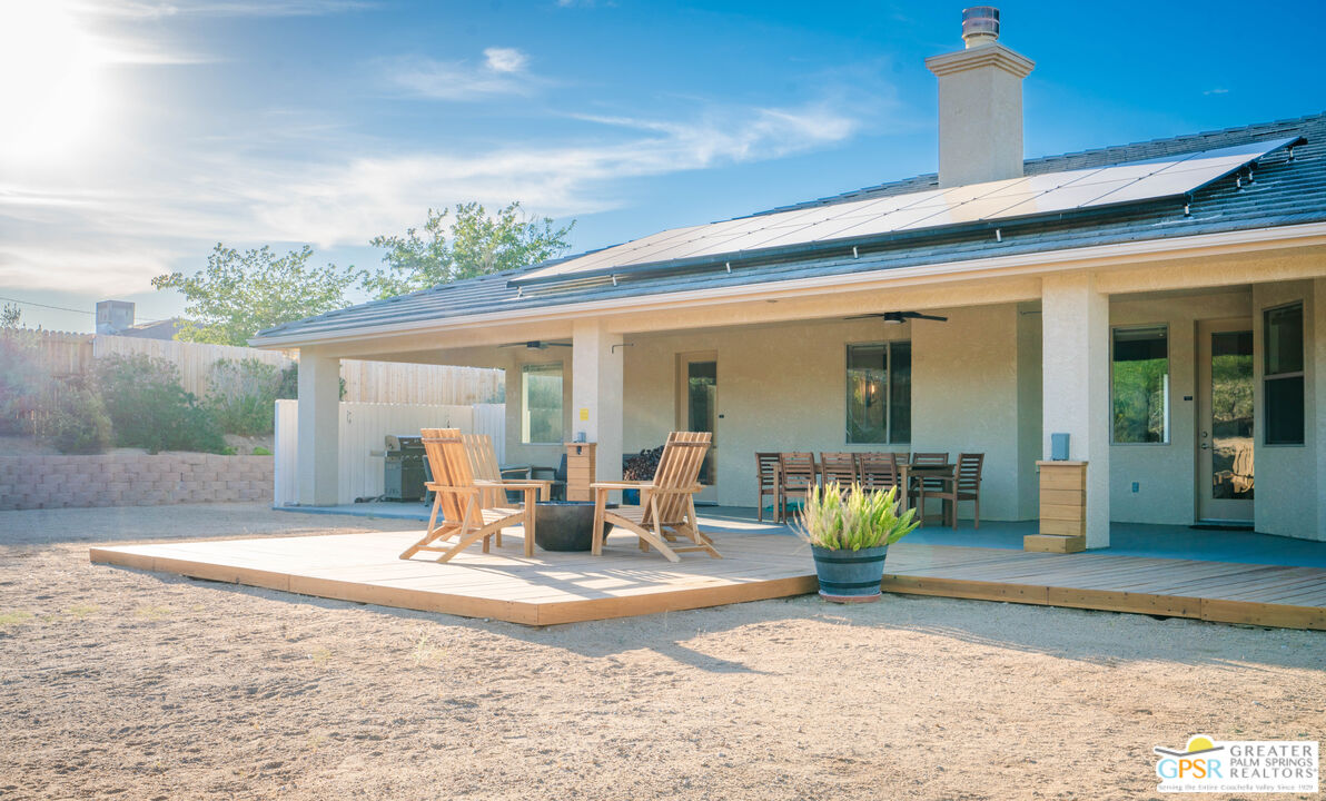 7514 Sunset Road Joshua Tree, CA 92252 - Photo 45 of 69 a view of a patio with table and chairs and potted plants