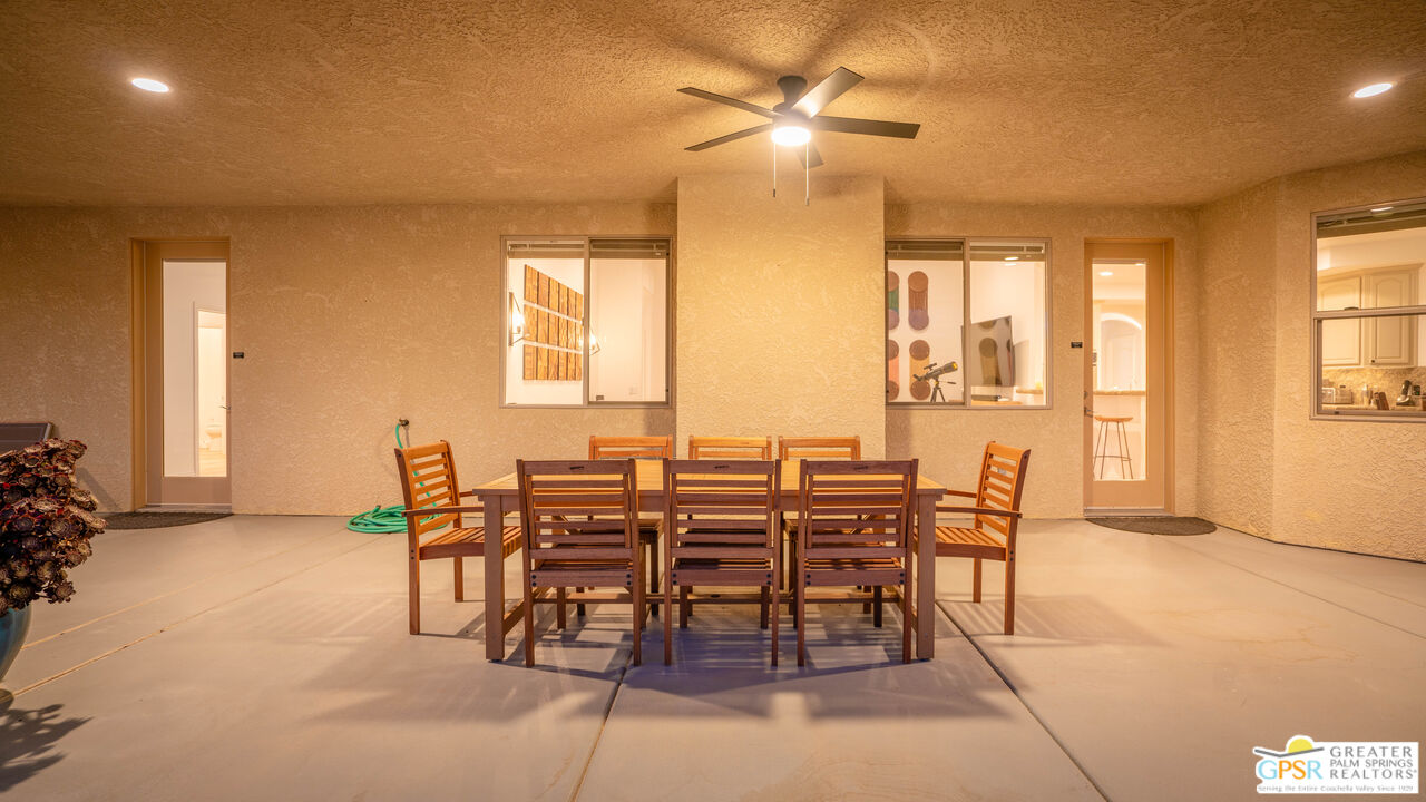 7514 Sunset Road Joshua Tree, CA 92252 - Photo 52 of 69 a view of a dining room with furniture and a chandelier