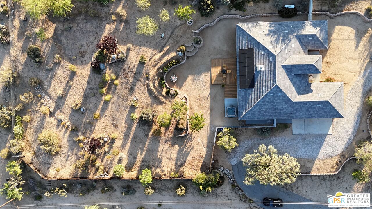 7514 Sunset Road Joshua Tree, CA 92252 - Photo 63 of 69 an aerial view of a house with a yard and a large tree