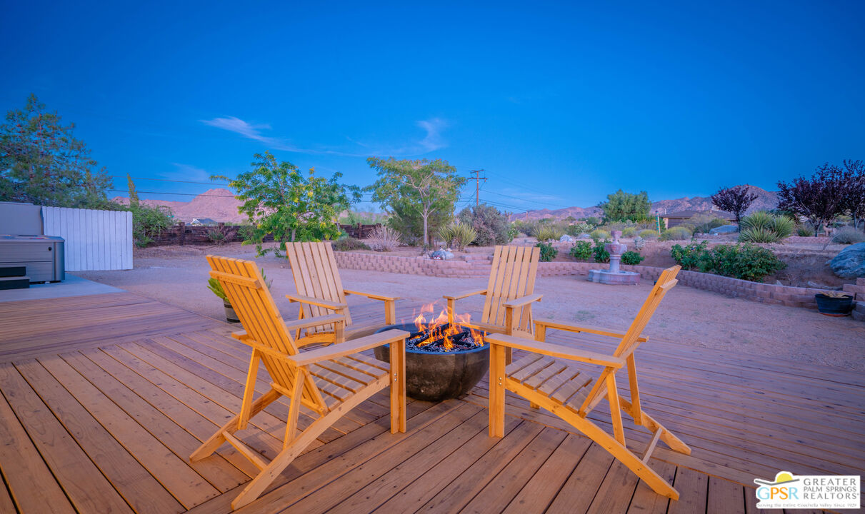 7514 Sunset Road Joshua Tree, CA 92252 - Photo 7 of 69 a roof deck with table and chairs potted plants with wooden floor