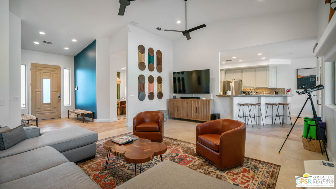 7514 Sunset Road Joshua Tree, CA 92252 - Photo 8 of 69 a living room with furniture and a flat screen tv