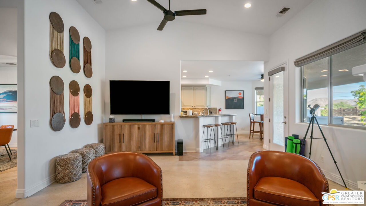 7514 Sunset Road Joshua Tree, CA 92252 - Photo 9 of 69 a living room with furniture and a flat screen tv