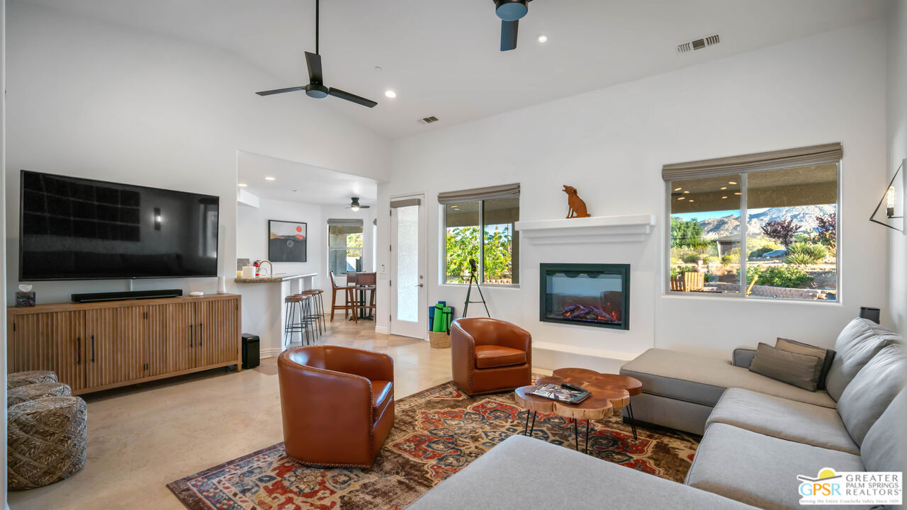 7514 Sunset Road Joshua Tree, CA 92252 - Photo 10 of 69 a living room with furniture and a flat screen tv