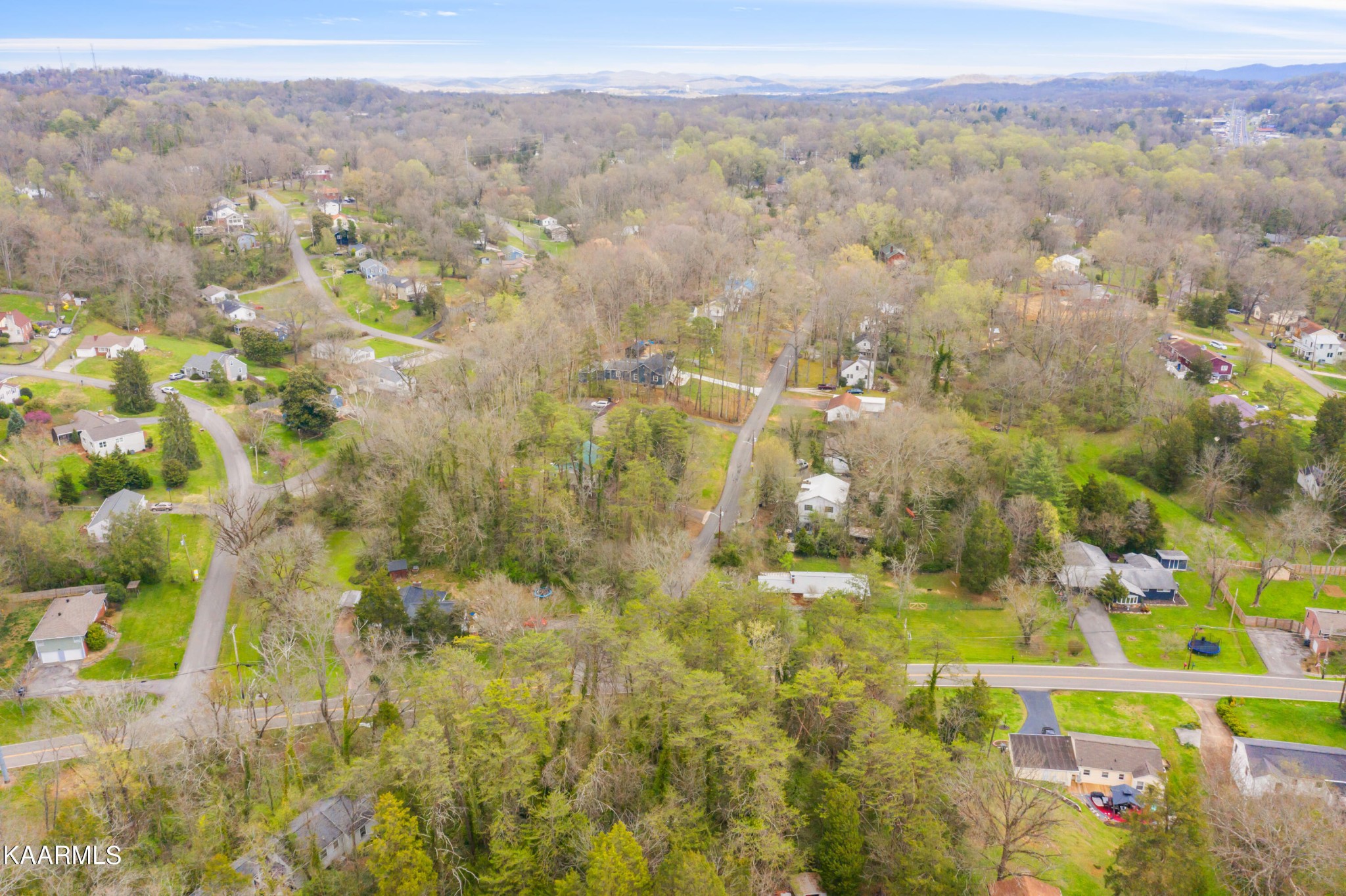 303 Stone Road Knoxville, TN 37920 - Photo 6 of 13 a view of residential houses with swimming pool and mountain view