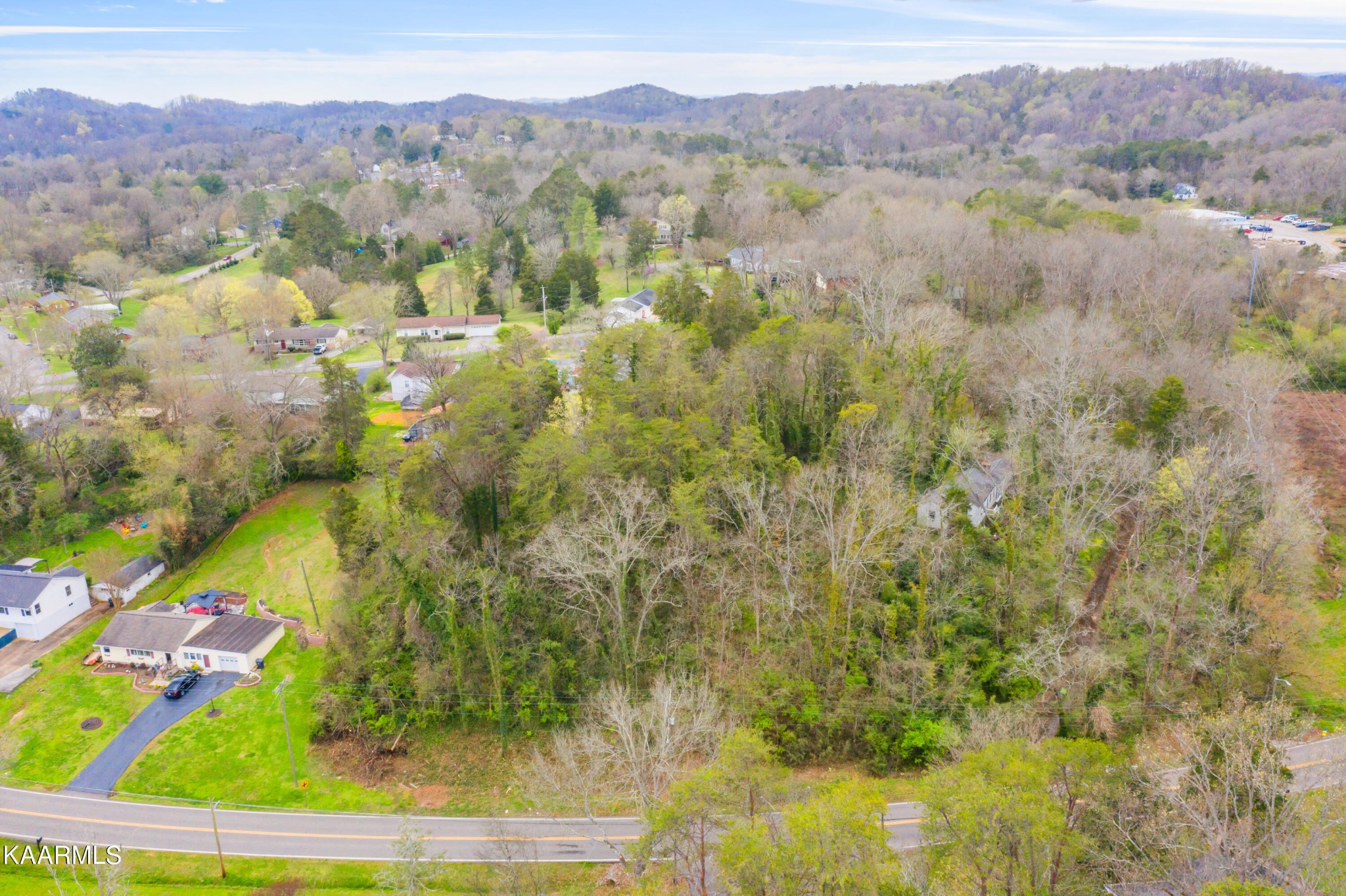 303 Stone Road Knoxville, TN 37920 - Photo 9 of 13 a view of a lake with mountains in the background