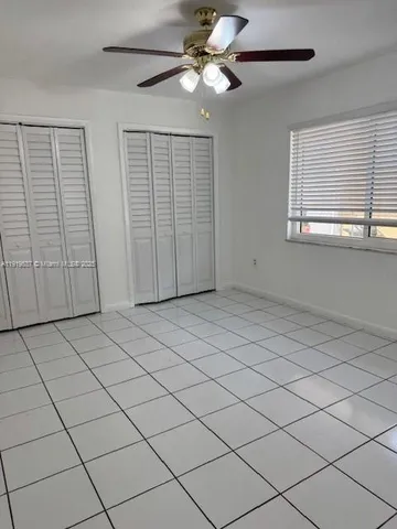 a view of empty room with windows