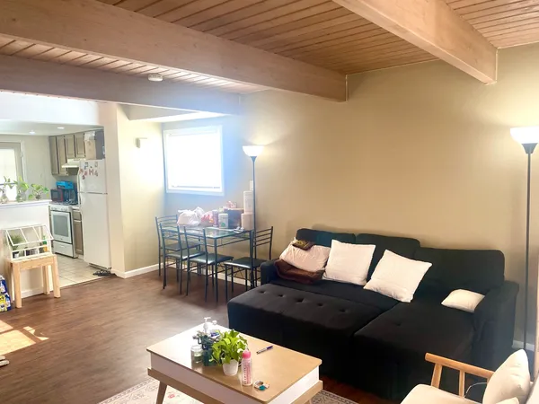 a living room with furniture and a table