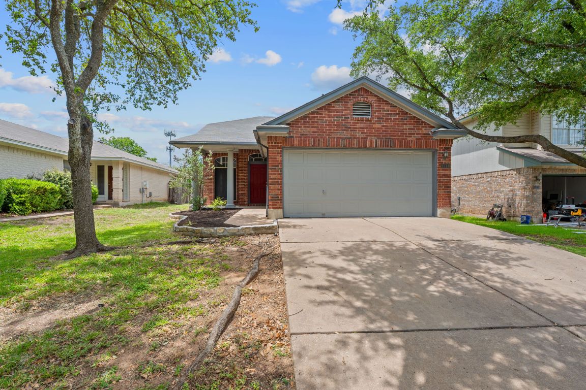 1514 Thibodeaux Drive Round Rock, TX 78664 - Photo 1 of 1 a front view of a house with a yard and garage