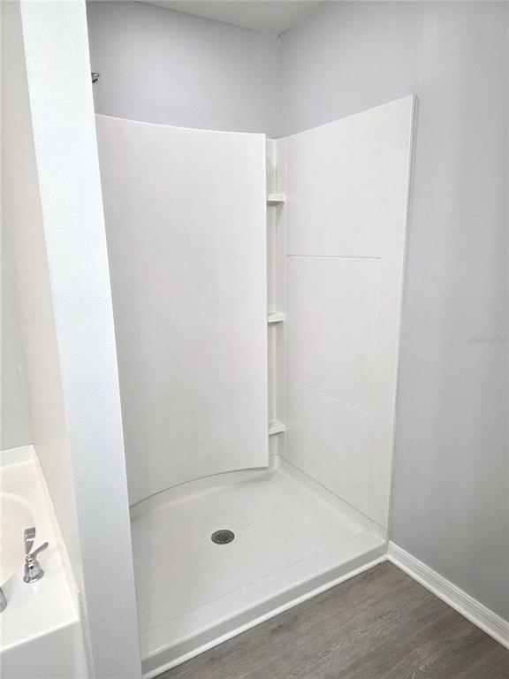 729 Chatham Walk Drive Ruskin, FL 33570 - Photo 13 of 15 a bathroom with a bath tub