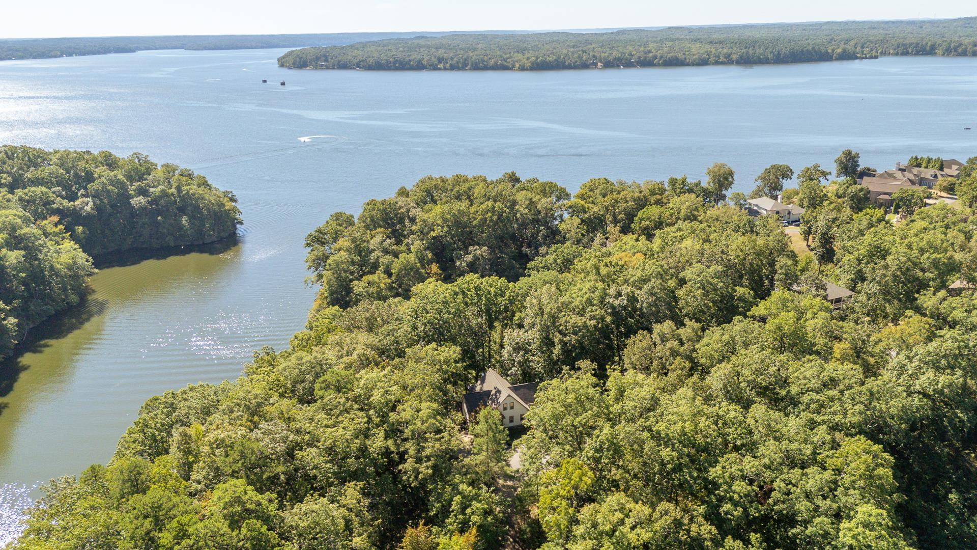 120 Pier Point Savannah, TN 38372 - Photo 4 of 38 Drone / aerial view of a heavily wooded area and a nearby body of water