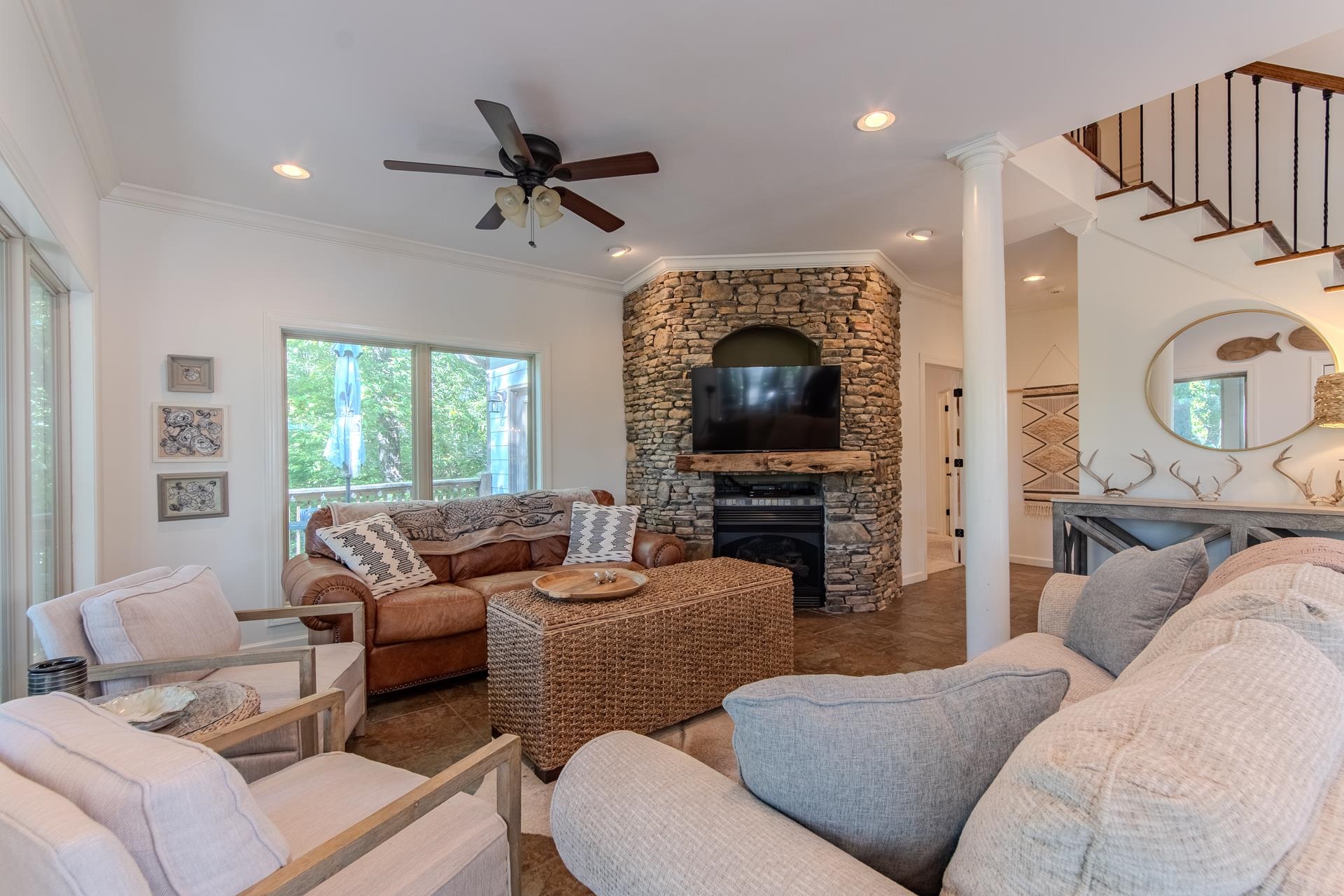 120 Pier Point Savannah, TN 38372 - Photo 10 of 38 Living area featuring crown molding, a stone fireplace, a ceiling fan, and recessed lighting