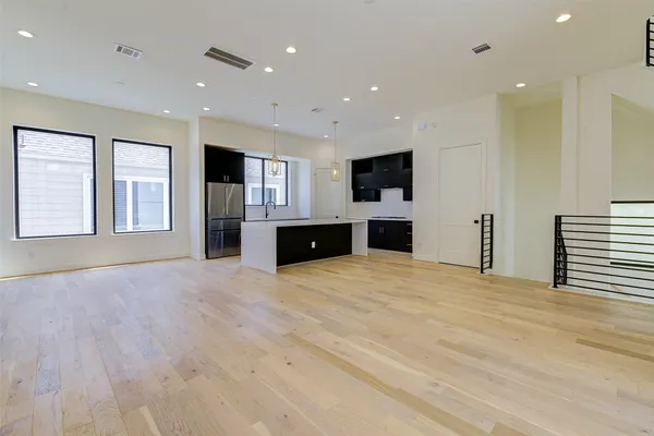 a kitchen with stainless steel appliances a refrigerator and a stove top oven