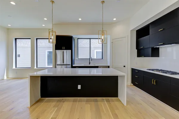 a large bathroom with a sink and a fireplace