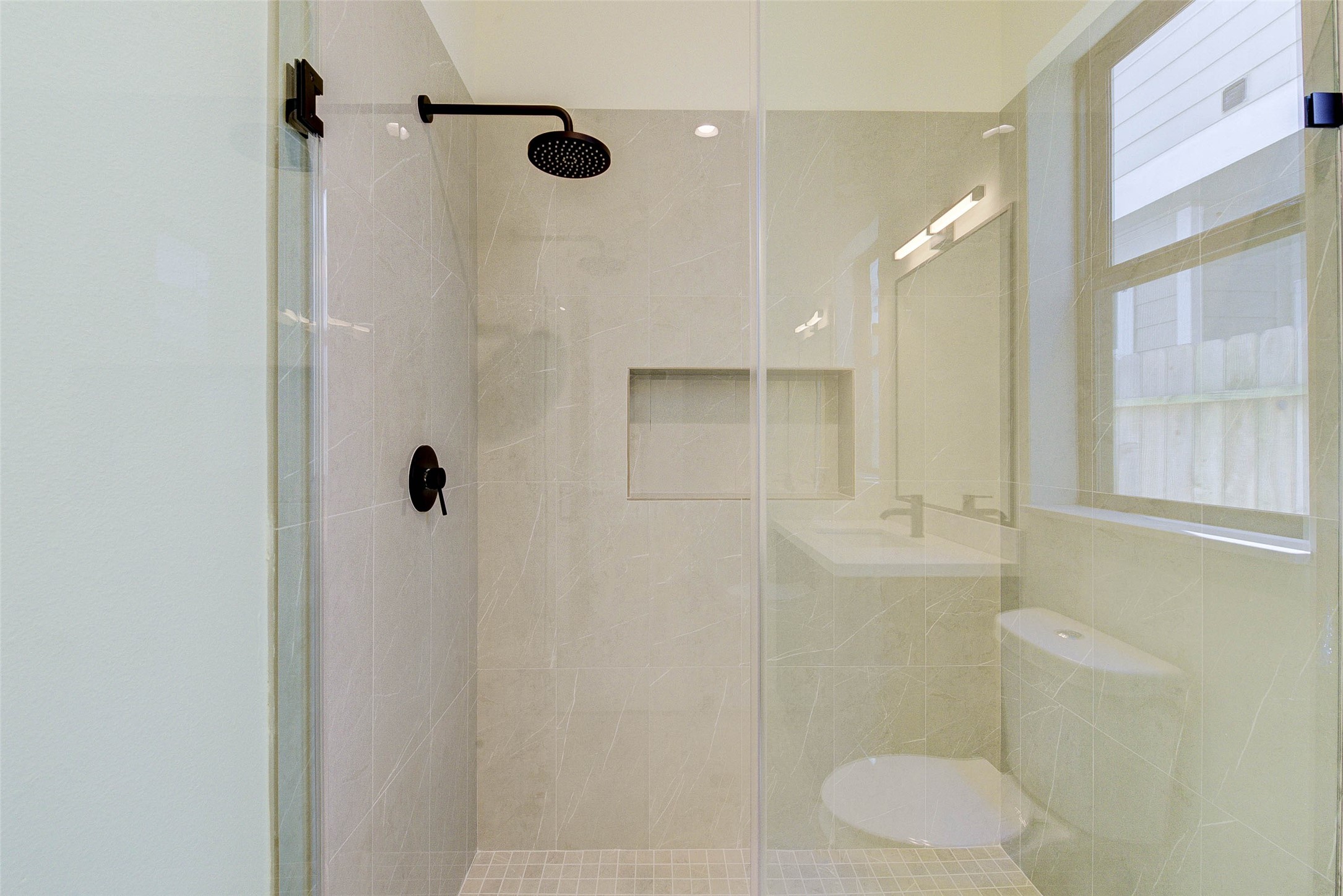1803 Dunlavy Street Houston, TX 77006 - Photo 18 of 35 a bathroom with a shower and a toilet