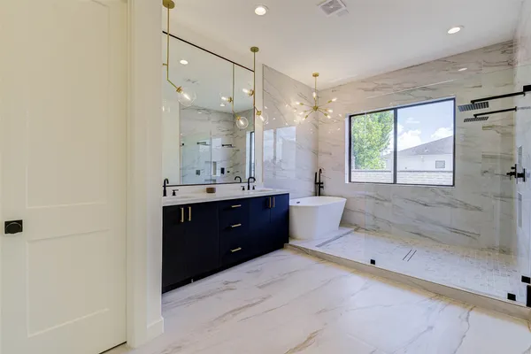 a bathroom with a double vanity sink mirror and double