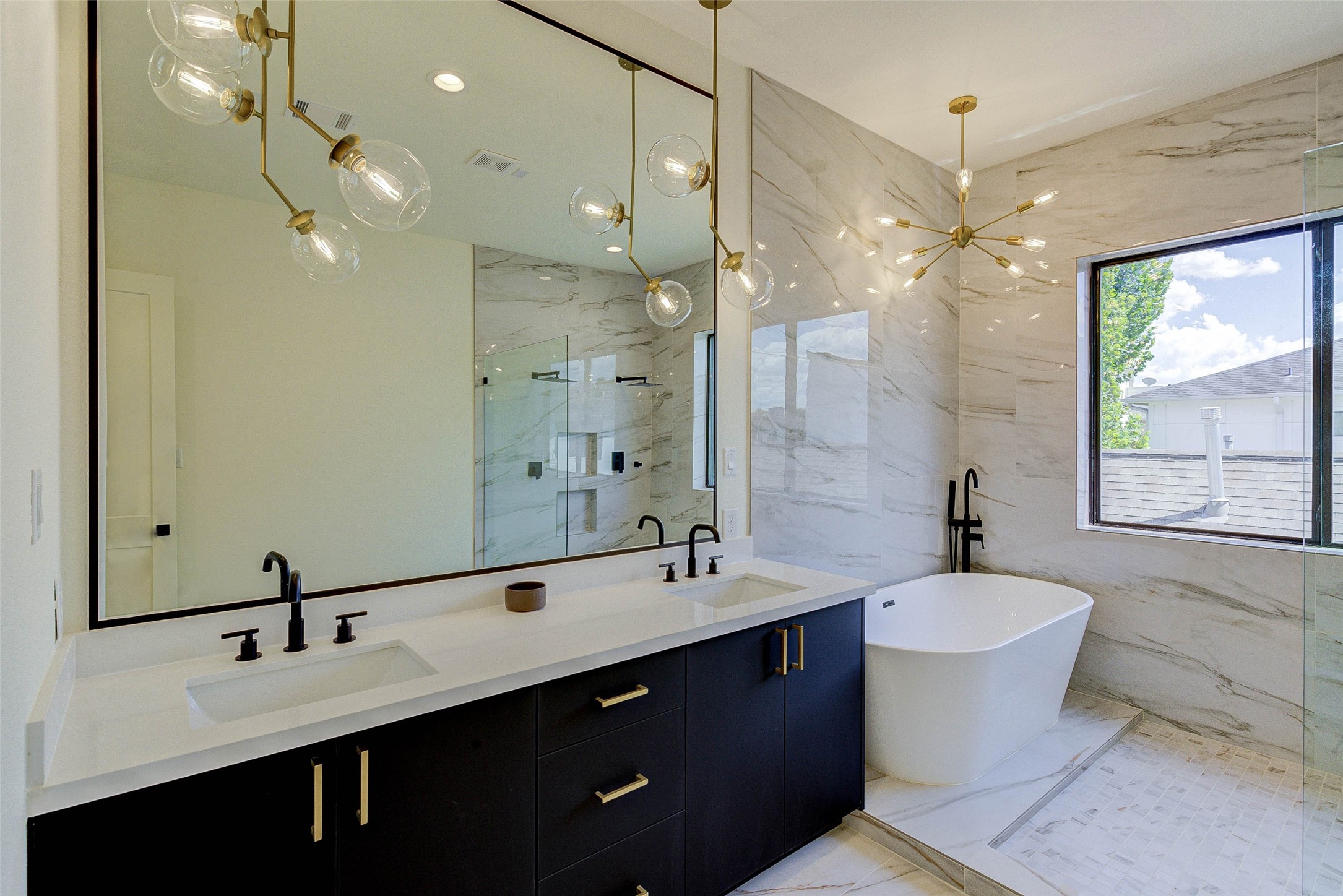1803 Dunlavy Street Houston, TX 77006 - Photo 25 of 35 a bathroom with a double vanity sink mirror and double