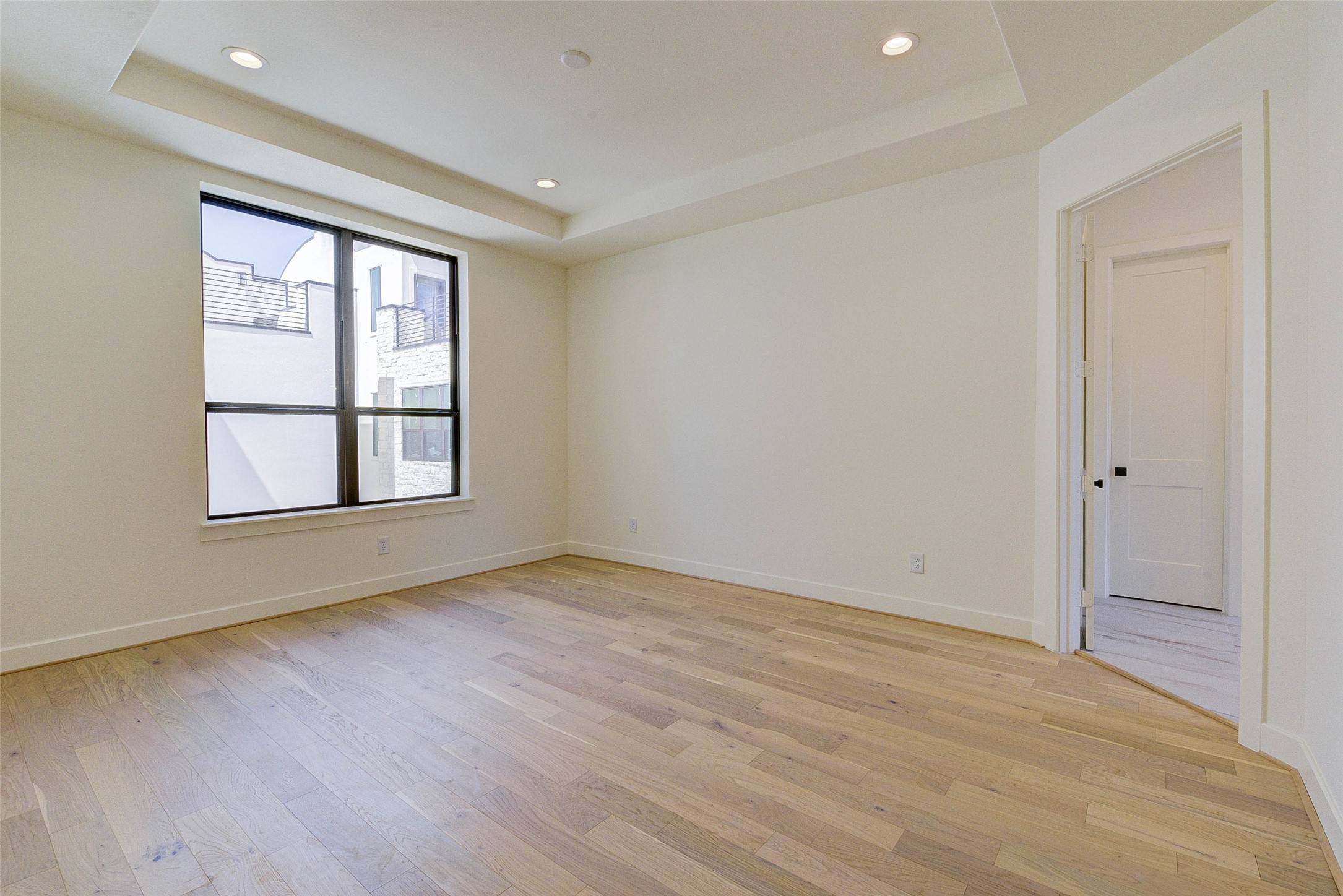 1803 Dunlavy Street Houston, TX 77006 - Photo 26 of 35 an empty room with wooden floor and windows