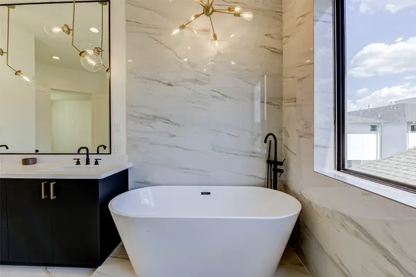 a bathroom with a bathtub and shower