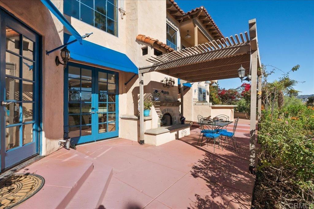 3577 Stonegate Place Fallbrook, CA 92028 - Photo 49 of 60 Covered Patio with Outdoor Fireplace located off the kitchen