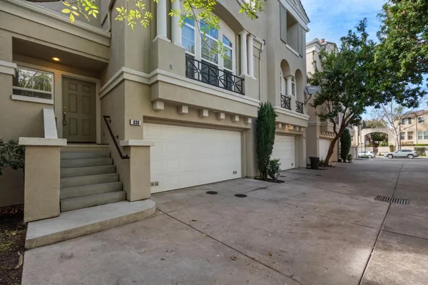a view of a white building with many windows