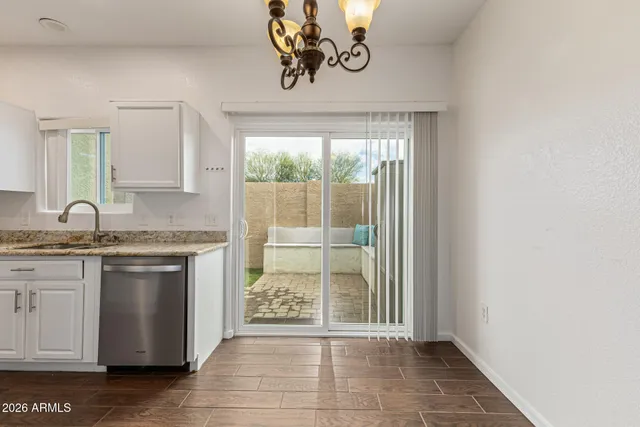 a view of a kitchen with a sink and a window