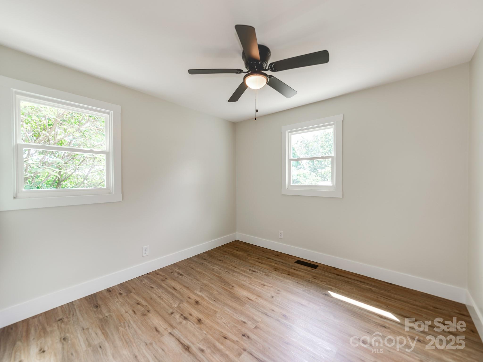 5404 Hope Road Vale, NC 28168 - Photo 11 of 28 a view of empty room with wooden floor and fan