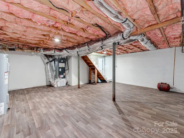 a view of a room with wooden floor