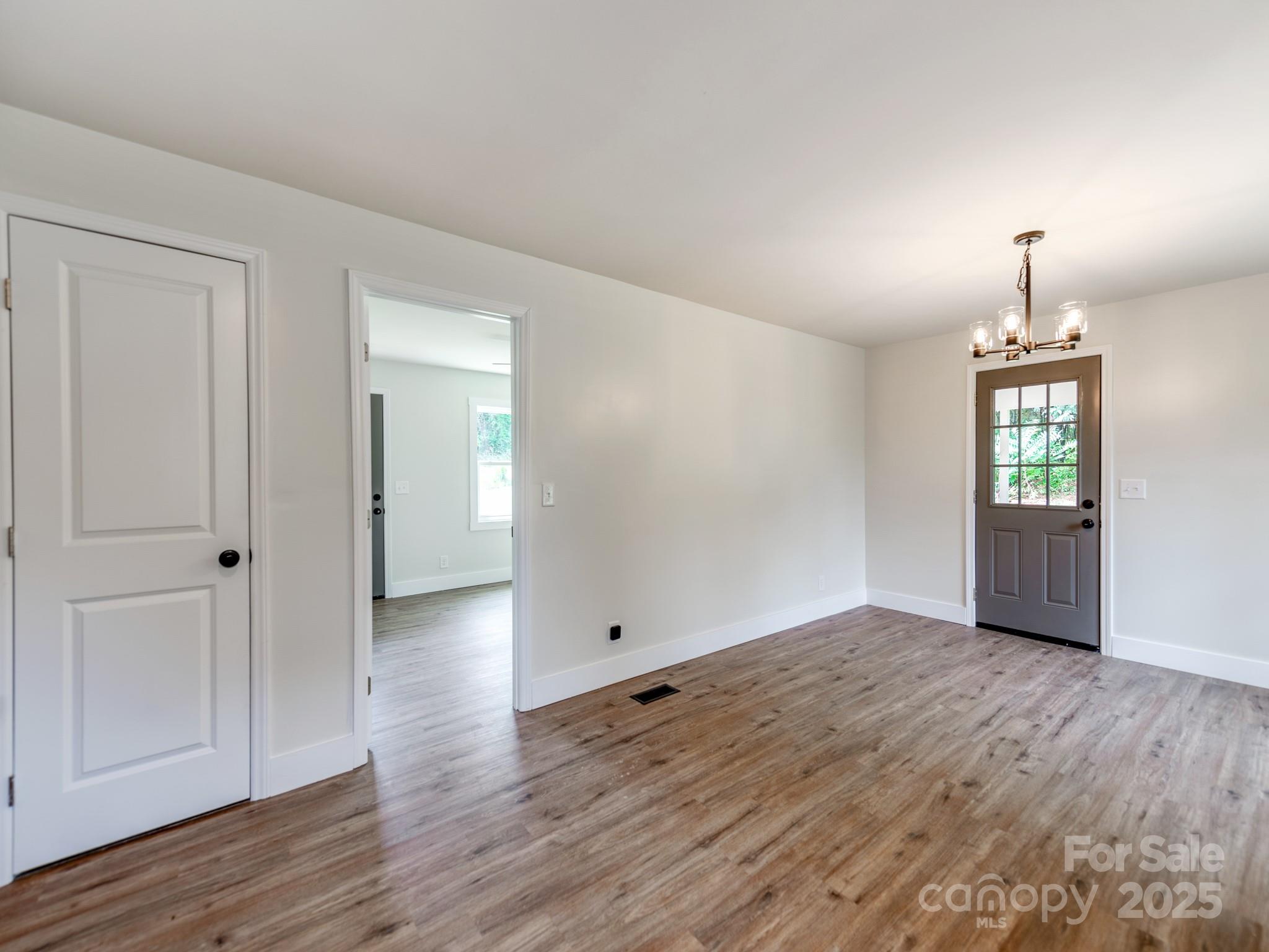 5404 Hope Road Vale, NC 28168 - Photo 10 of 28 a view of empty room with wooden floor