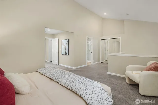 a bedroom with a bed and a couch