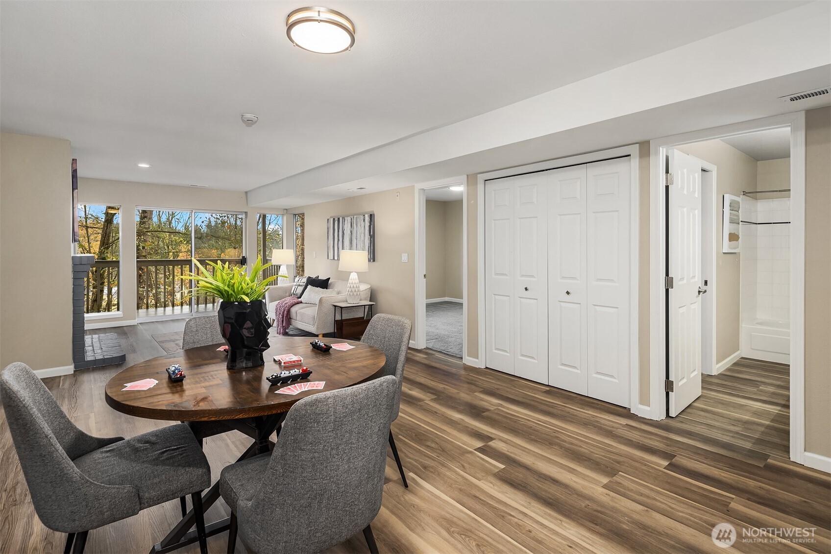 7250 Old Redmond Road, Unit C111 Redmond, WA 98052 - Photo 29 of 39 a view of a dining room with furniture and wooden floor