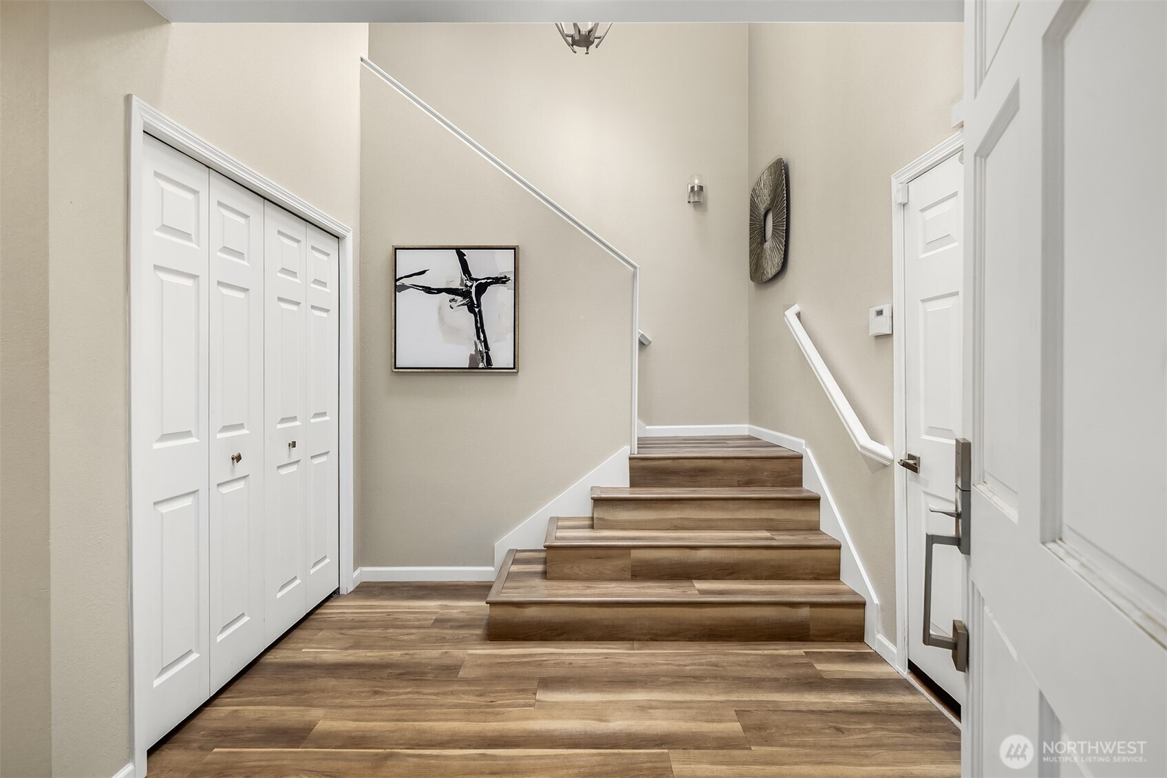 7250 Old Redmond Road, Unit C111 Redmond, WA 98052 - Photo 3 of 39 a view of staircase with wooden floor and white walls