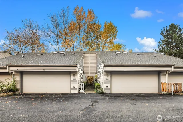a front view of a house with a garage
