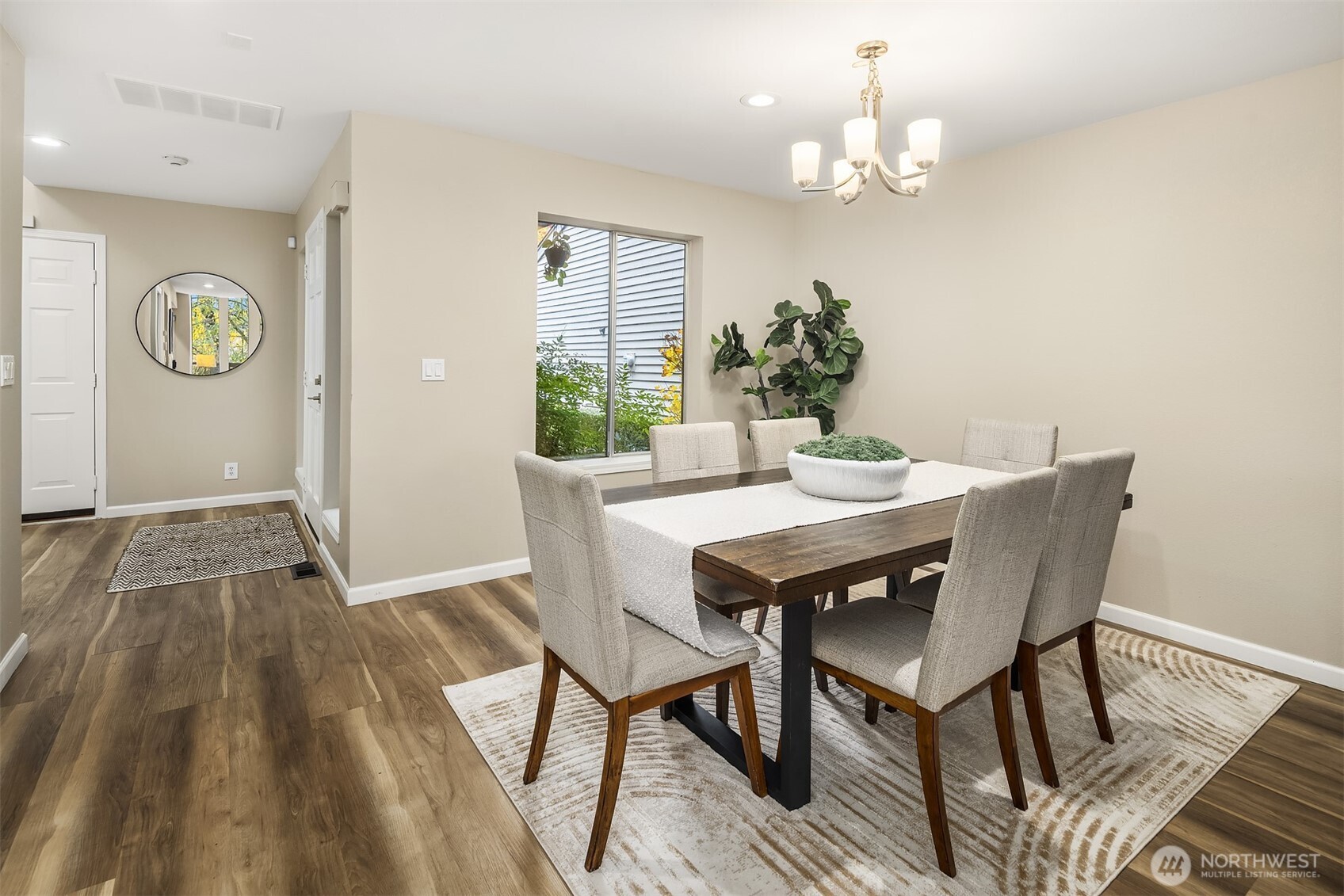 7250 Old Redmond Road, Unit C111 Redmond, WA 98052 - Photo 4 of 39 a view of a dining room with furniture and chandelier