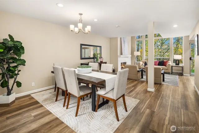 a view of a dining room with furniture window and wooden floor