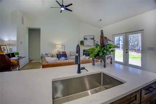 a kitchen with a sink and a refrigerator
