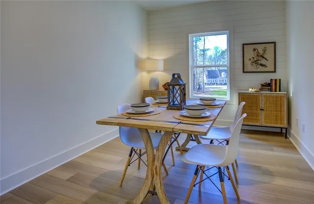 a view of a dining room with furniture and window