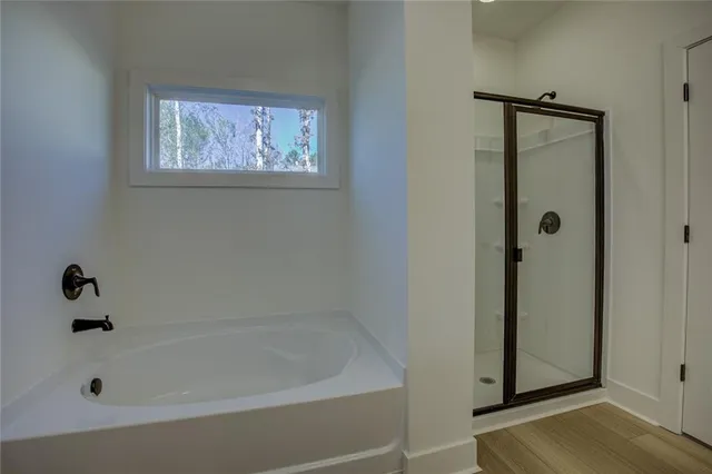 a white bath tub sitting next to a window