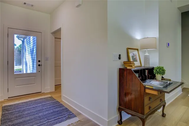 a room with furniture and wooden floor