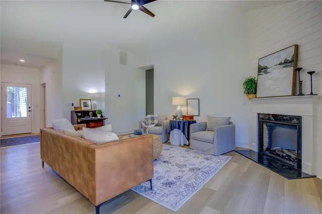a living room with furniture and a fireplace